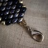 Chic & Sensueel, slangenpatroon armband in zwart en goud