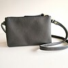 Leren crossbody tas met bruin/zwart koeienprint