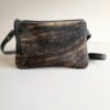 Leren crossbody tas met bruin/zwart koeienprint