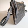 Leren crossbody tas met bruin/zwart koeienprint