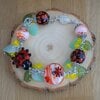 Vrolijk & Botanisch, lieveheersbeestje tuinarmband met handgemaakte glaskralen