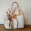 Leren handtas met bijpassende Bag charm