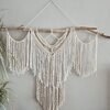 Crème kleurige macrame wandhanger.