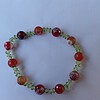 Honey and Grass: armband met vuuragaat en olivijn