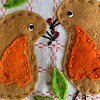 Leuke wandhanger met 6 roodborstjes