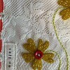 Lief wandkleedje met een vaasje met bloemen