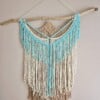 Wandhanger turquoise, beige.