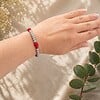 Armband en oorbellen set - met rode en grijze glaskralen.