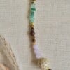 Gouden ketting met boeisluiting en opvallende keramieke kraal | Meadow