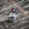 Handgemaakte zilveren ring met roosgeslepen granaat