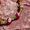 Honeymeadow: armband met vuuragaat en olivijn