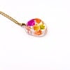 Ketting met Kiezelvormige Hanger Gevuld met Echte Bloem uit Den Haag (Fleur de Soleil)