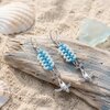 Strandwandeling & Zeezicht, statement oorbellen met bultrug walvissen