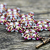 Byzantijnse kralenarmband roze/amethyst/brons, Miyuki en Swarovski – handgeweven statement armband
