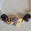 Gouden armband keramieken zeester