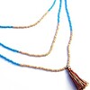 Halsketting met turquoise, oranje, beige rocailles. Handgemaakte ketting met kwastje, 3 rijen glaskralen en beige houten kralen, boho chic