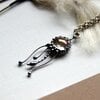 Handgemaakte kwallenketting met transparant glas en zilverkleurig koper