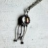 Handgemaakte kwallenketting met transparant glas en zilverkleurig koper