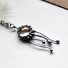 Handgemaakte kwallenketting met transparant glas en zilverkleurig koper