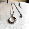 Handgemaakte ronde hangerketting met transparant glas en zilverkleurig koper