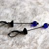 Handgemaakte vliegenzwamoorbellen met blauw glas en zwart gepatineerd koper