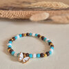 Vrolijke witte/gouden vlinder armband