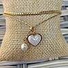 Dubbele armband met hart & parel ā RVS verguld