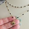 Dubbele RVS ketting – 16K goud verguld met zwarte details & zonhanger