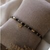 Elegante armband met zwarte Agaat & hartje – RVS 16K verguld
