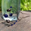 Handgemaakte handgemaakte haarvork met blauw glas en zwart gepatineerd koper