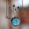 Handgemaakte paddenstoelenketting met blauw glas en zilverkleurig koper