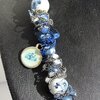 Delftsblauwe ketting met bloemenkralen en oud-Hollandse bedels