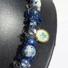Delftsblauwe ketting met bloemenkralen en oud-Hollandse bedels
