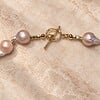 Roze barokparel ketting met vintage hartjeshanger