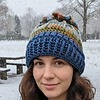 Gehaakte muts met bloem/blauw, groen, bruin