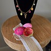 Goudkleurige ketting met verschillende zomerbedels