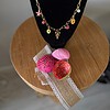 Goudkleurige ketting met verschillende zomerbedels