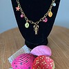 Goudkleurige ketting met verschillende zomerbedels