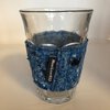 Thee-/koffieglas met sleeve van vilt