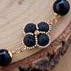 Zwarte Elegantie & Gouden Bloemen, handgeweven ketting met lavasteen en obsidiaan