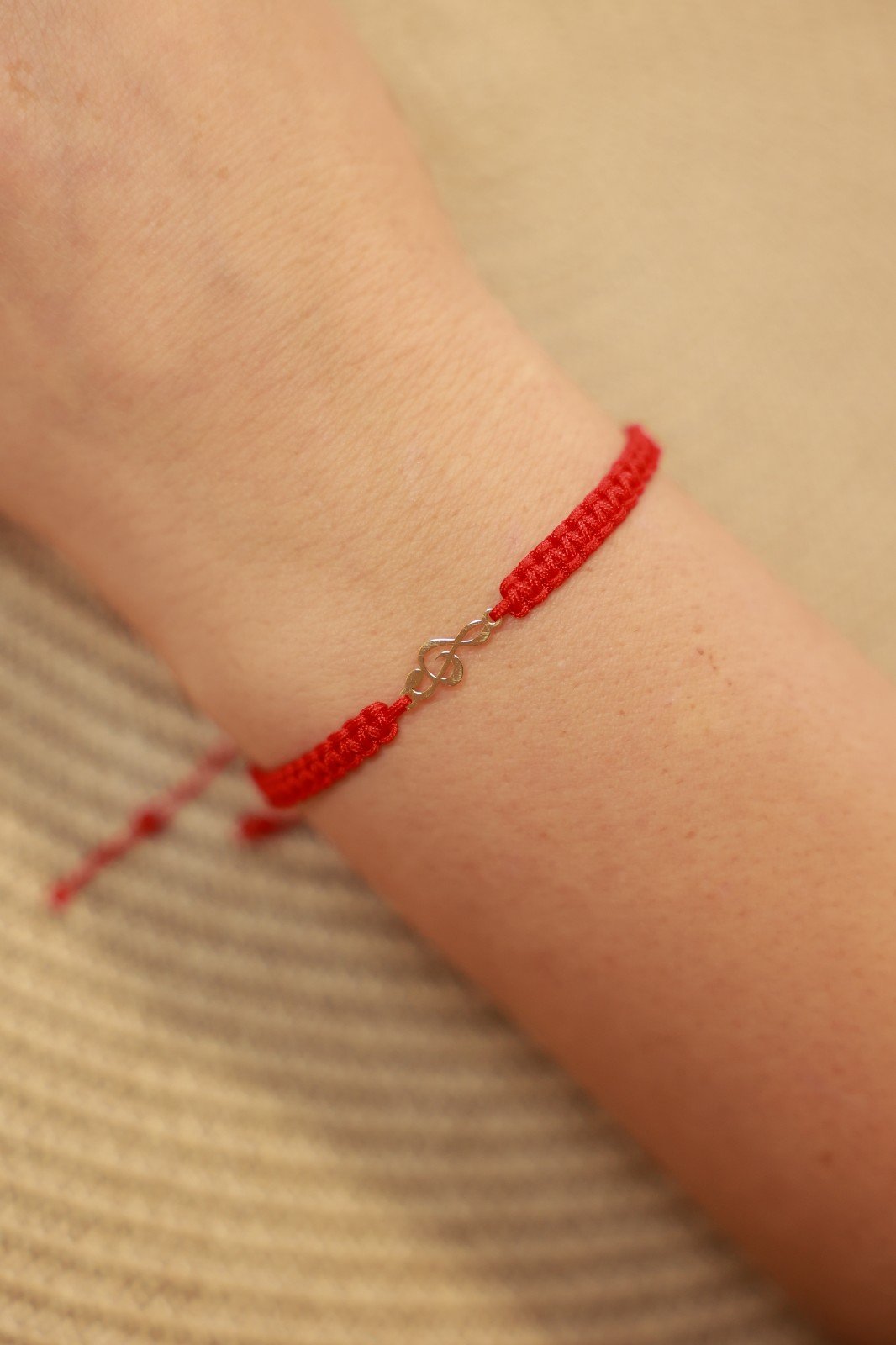 Armband met 14 karaat geelgouden muziek G-sleutel