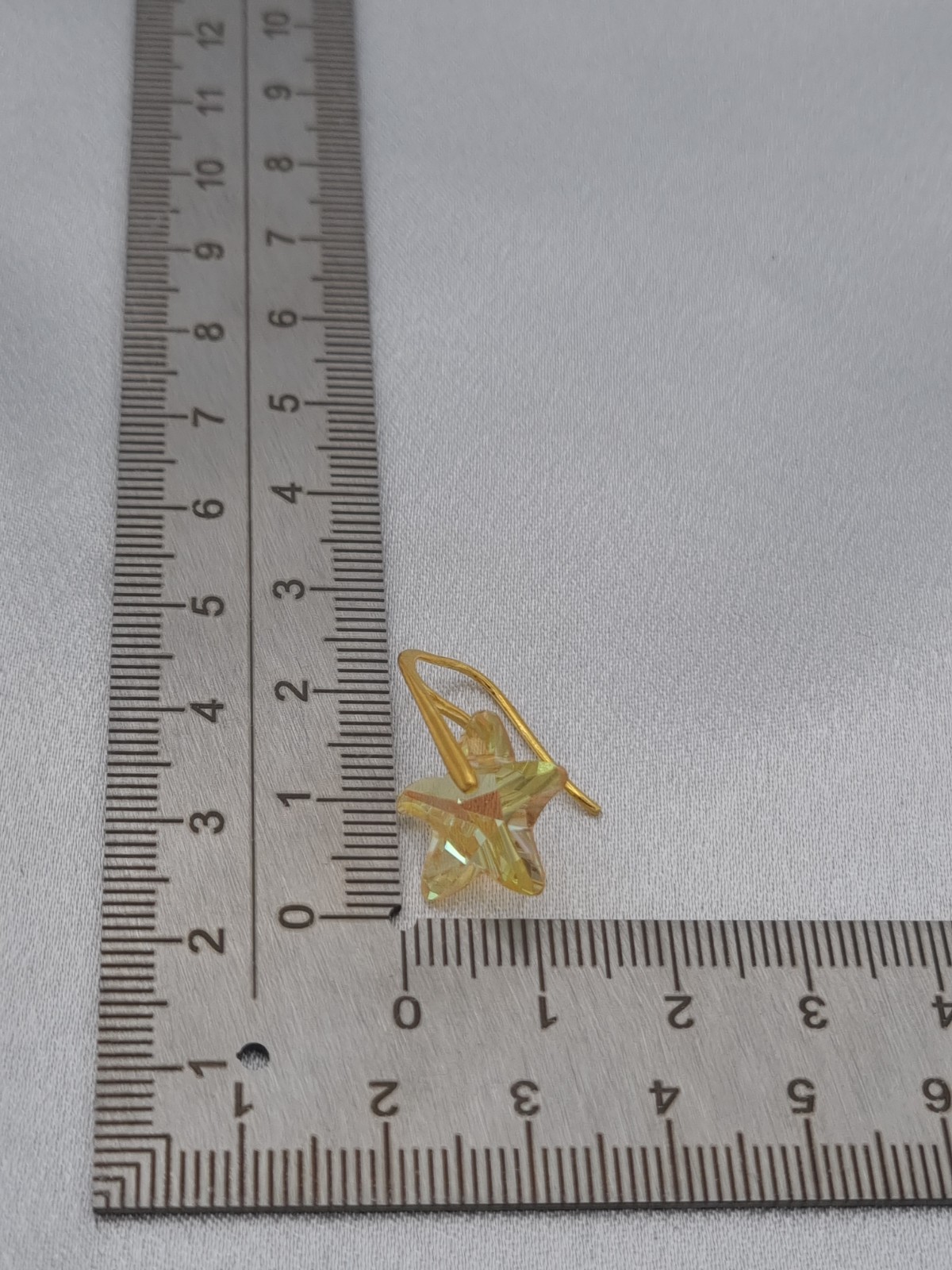 Vergulde oorbellen met kristallen zeester - geel