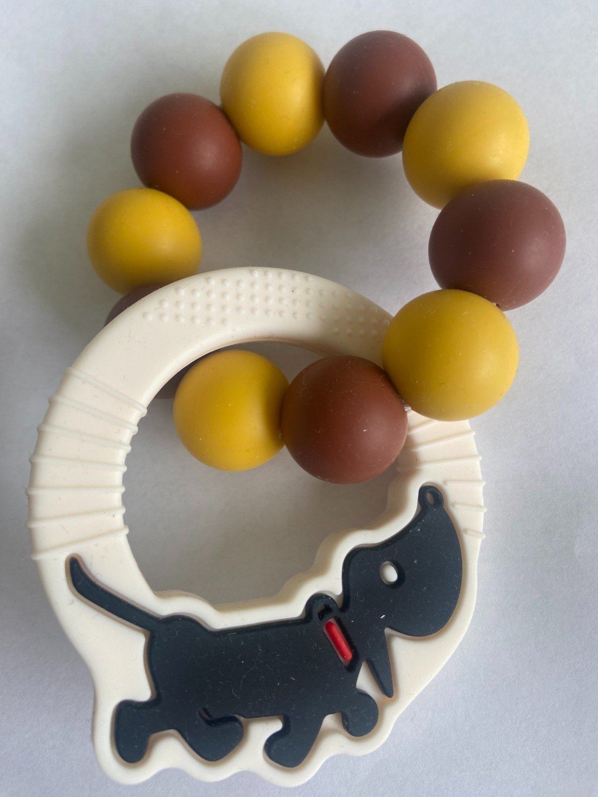 Bijtring Camel- met takkie hanger