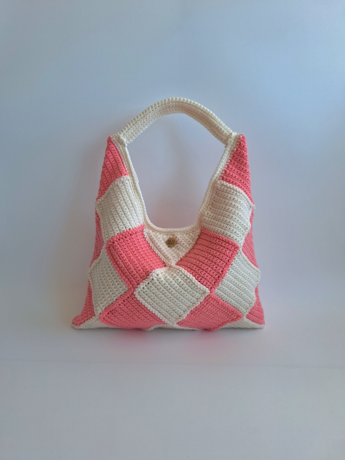 Gehaakte checker handtas 'Crème en koraaloranje'