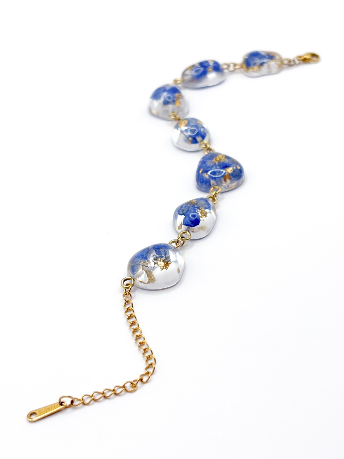 Armband met Steenvormige Hangers Gevuld met Echte Bloemen uit Den Haa… - 91841 Armband met Steenvormige Hangers Gevuld met Echte Bloemen uit Den Haag (The Tide)