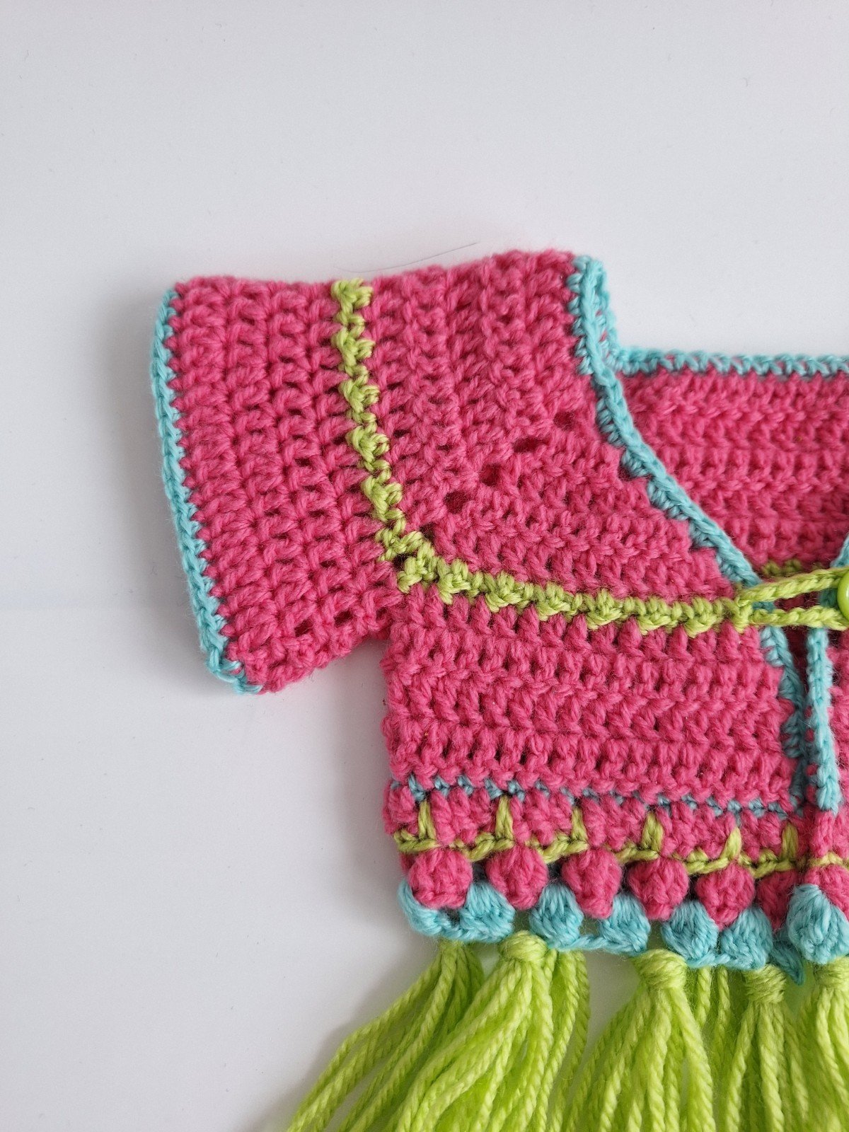 Gehaakt baby vestje | Roze, turquoise en groen met groene franjes