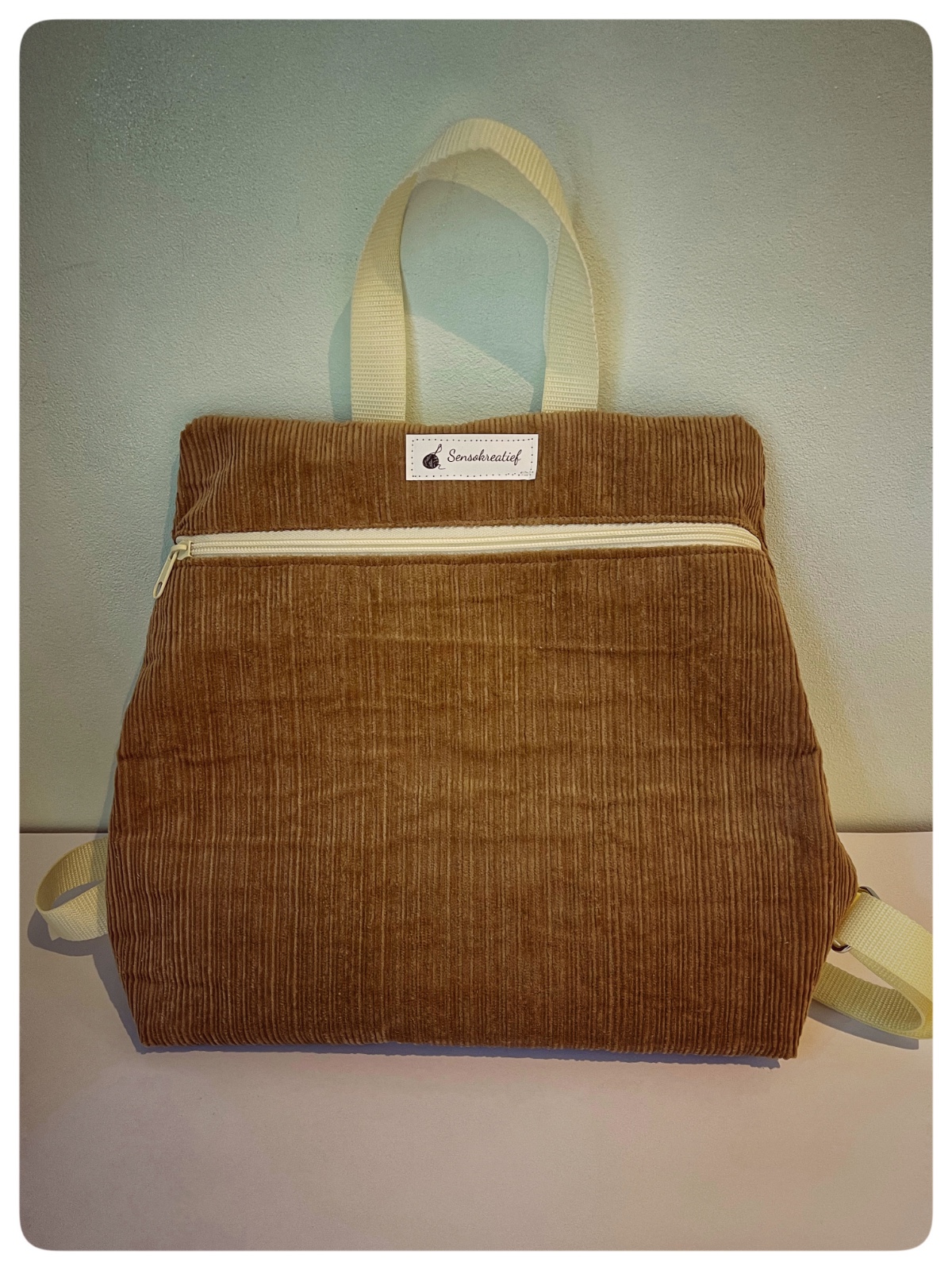 Rugtas van bruine corduroy stof