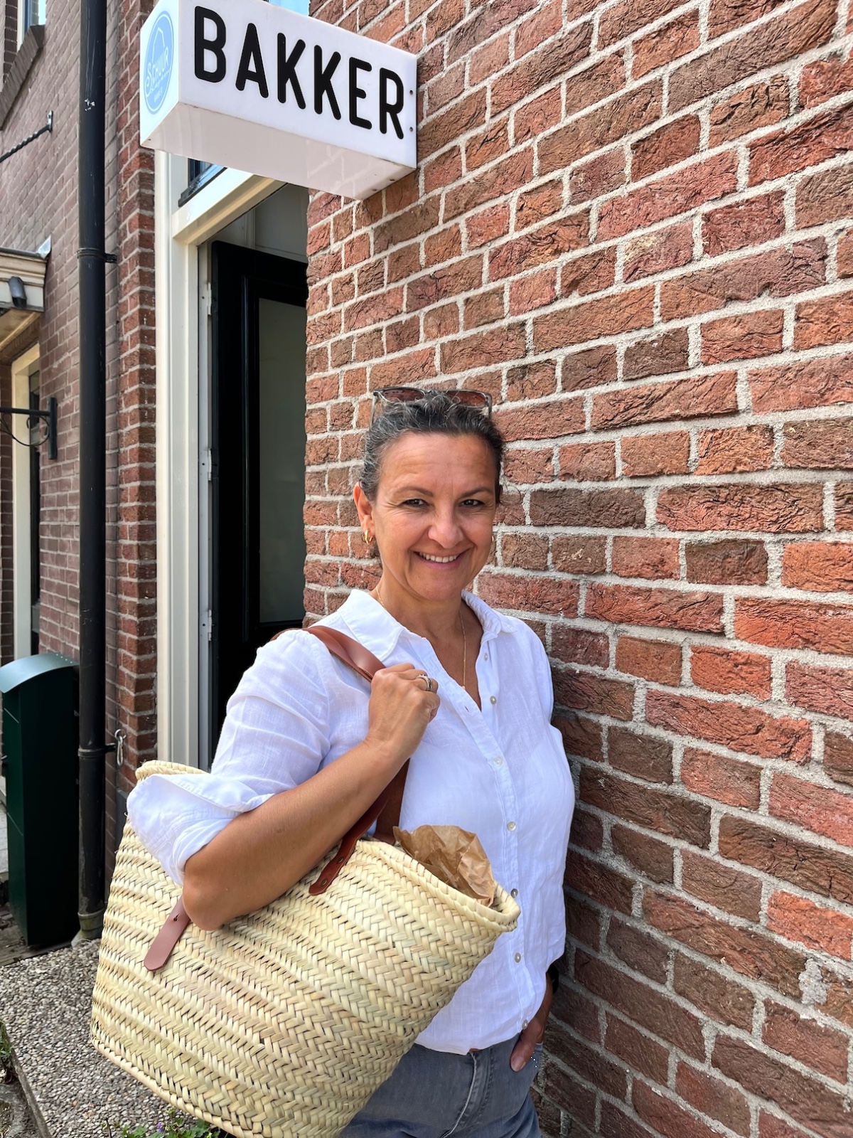 Rieten tas met verstelbare leren hengsels