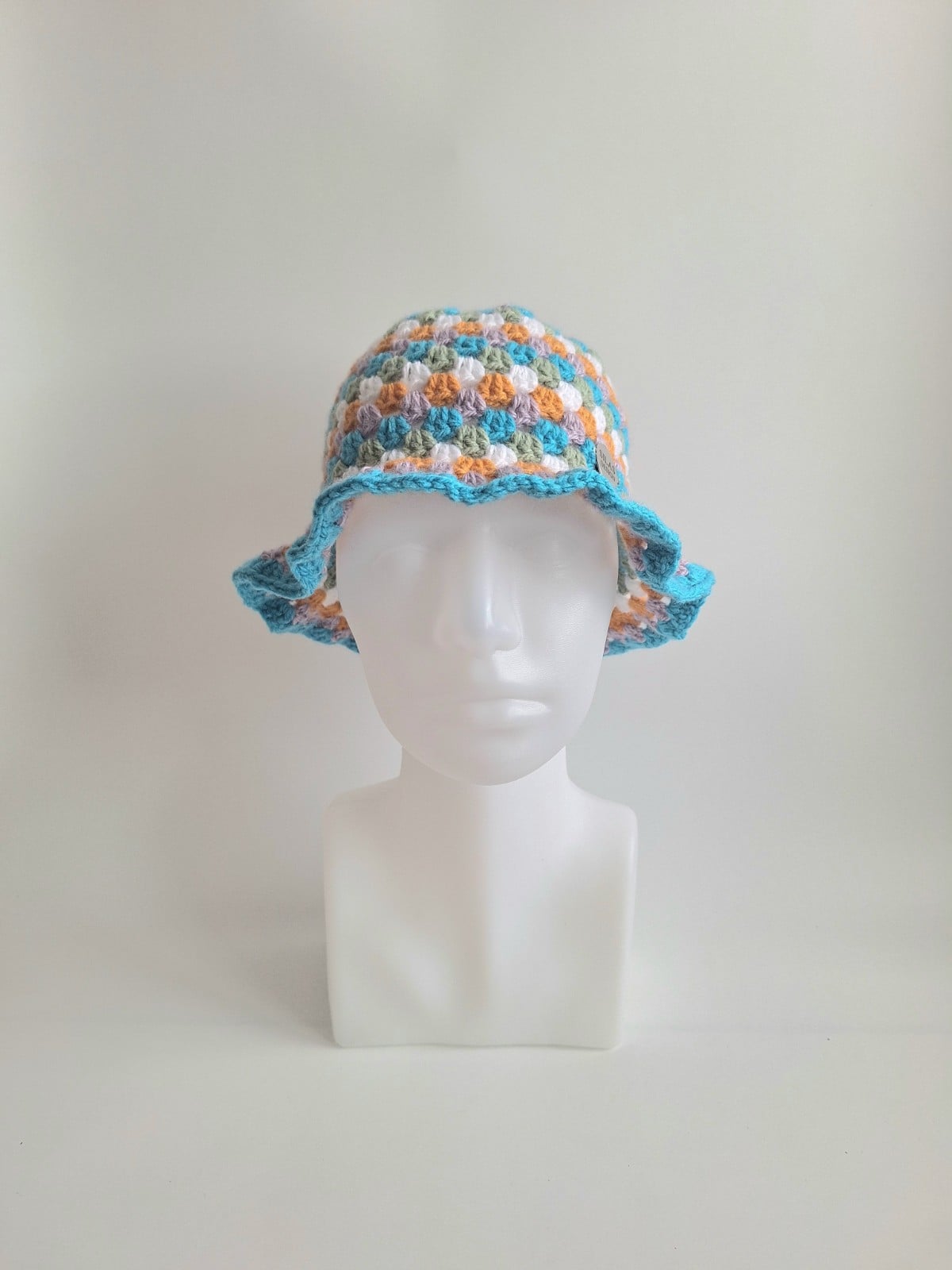 Gehaakte bucket hat | Oranje, lila, turquoise, sagegroen en wit