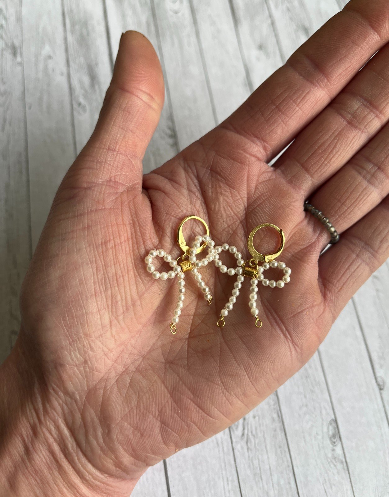 Vergulde oorbellen met strikjes - 59908.jpeg Vergulde oorbellen met strikjes